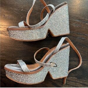 Free People Sparkly silver glitter wedges with a 4” heel, perfect for a party
